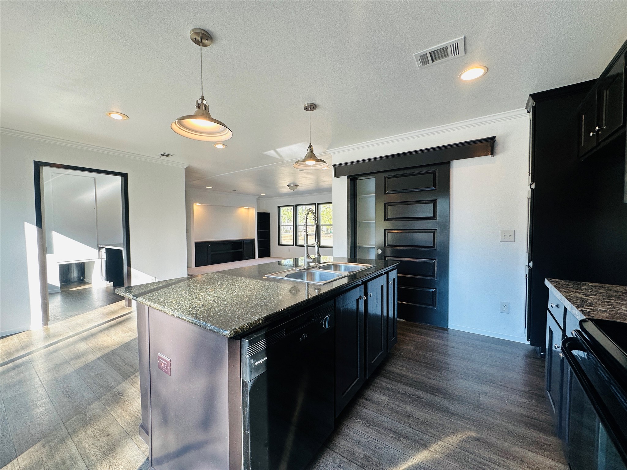 145 Campbell Street Shepherd, TX 77371 - Photo 9 of 36 a kitchen with stainless steel appliances granite countertop a sink stove and refrigerator
