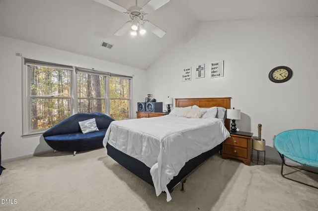 a bathroom with a double vanity sink a toilet and a mirror