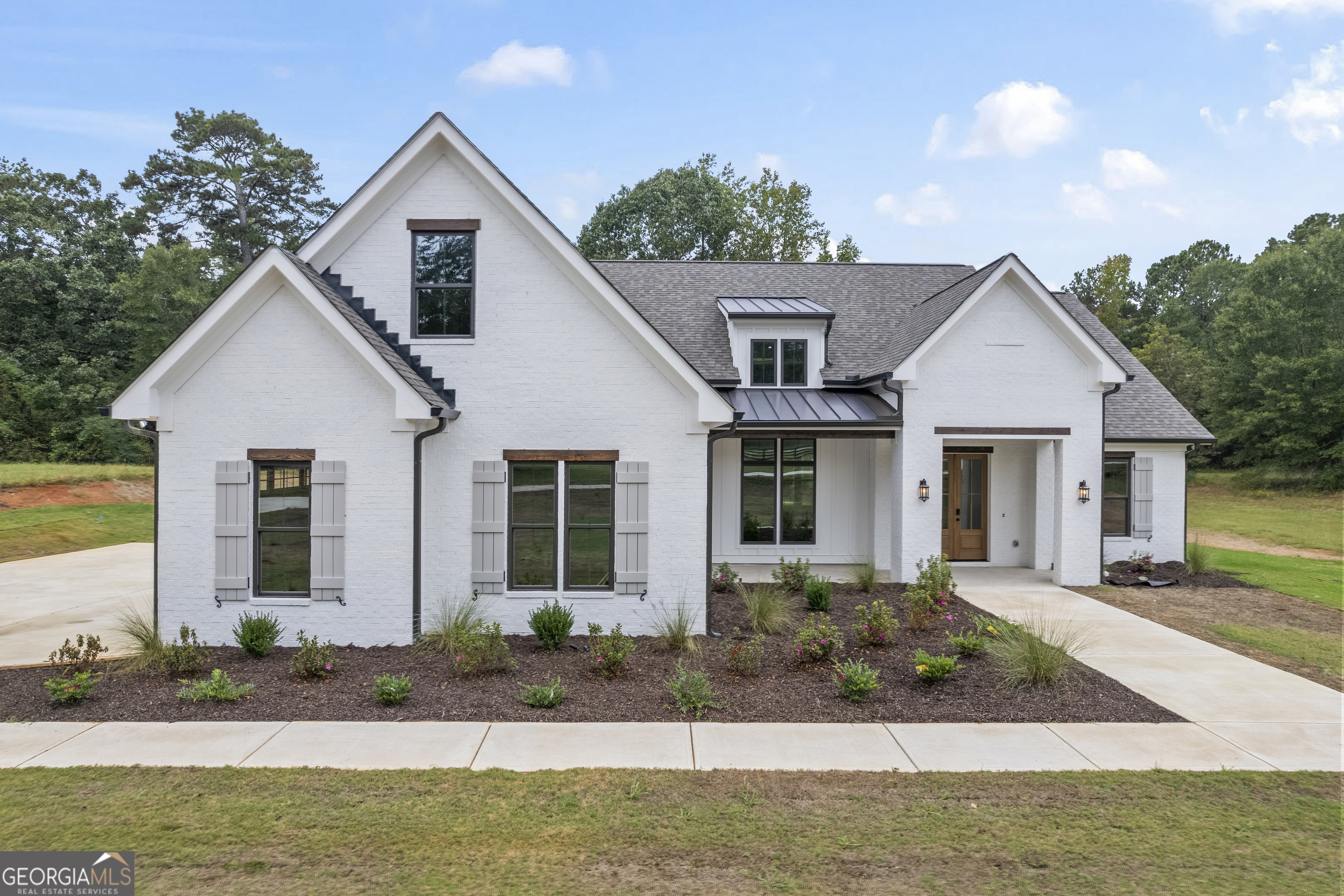 1231 John W Breedlove Road Monroe, GA 30656 - Photo 1 of 26 a front view of a house with garden