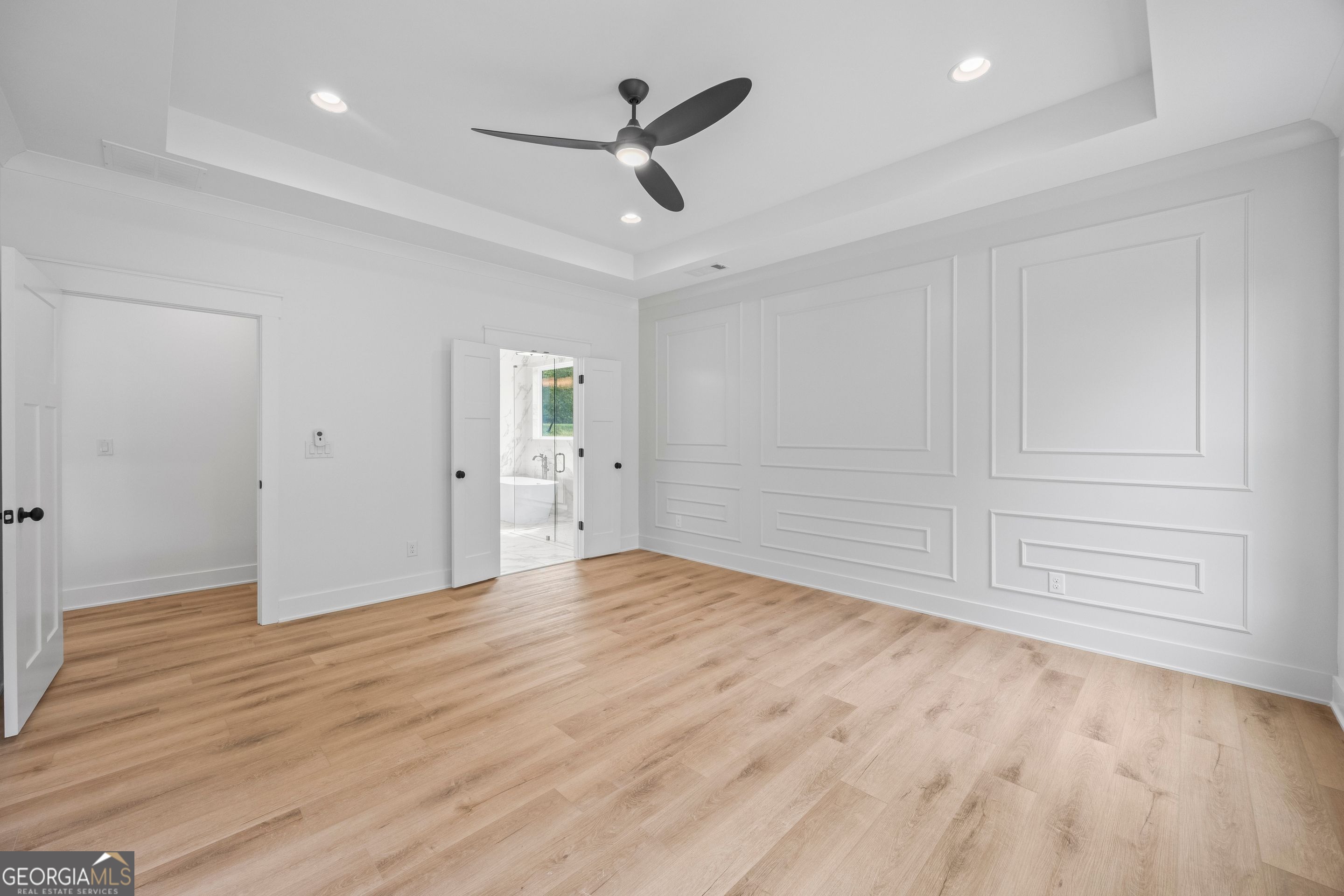 1231 John W Breedlove Road Monroe, GA 30656 - Photo 16 of 26 a view of empty room with wooden floor and ceiling fan