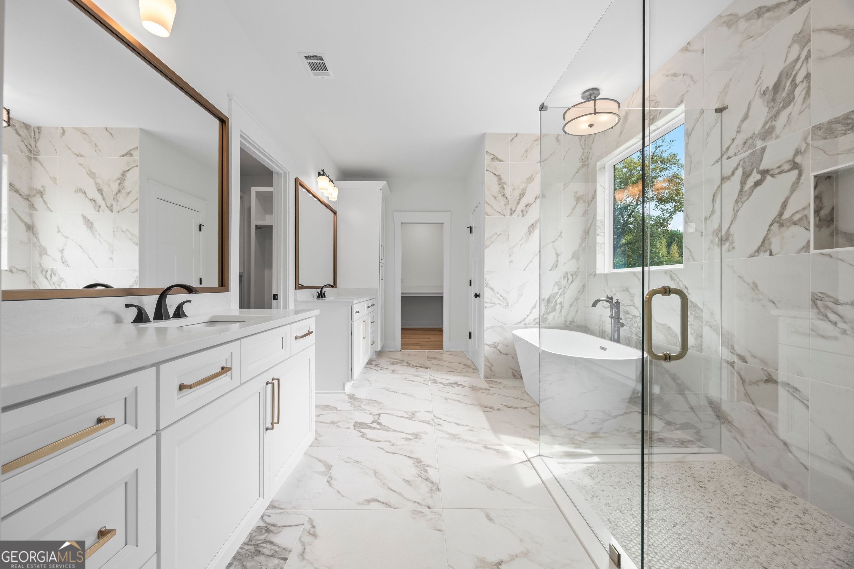 1231 John W Breedlove Road Monroe, GA 30656 - Photo 19 of 26 a spacious bathroom with a bathtub sink and mirror