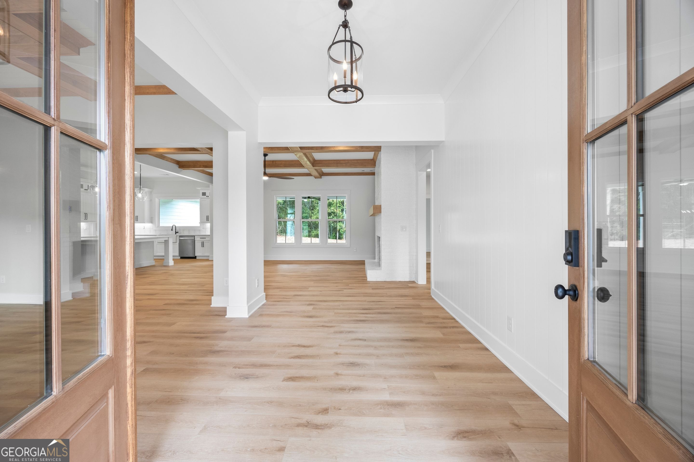 1231 John W Breedlove Road Monroe, GA 30656 - Photo 2 of 26 a view of a hallway with wooden floor and a living room
