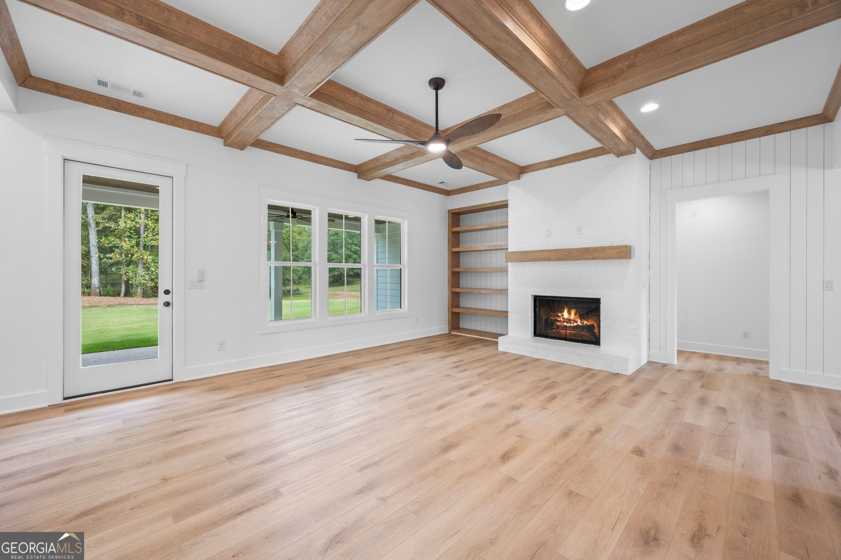 1231 John W Breedlove Road Monroe, GA 30656 - Photo 6 of 26 a view of an empty room with a fireplace and a window