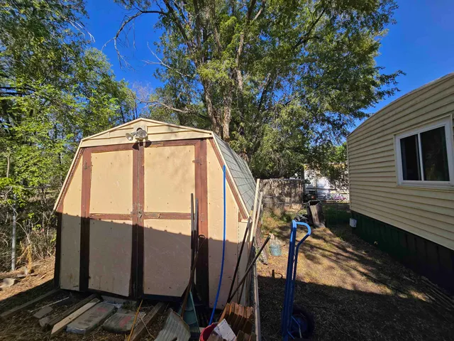 a view of a balcony with furniture