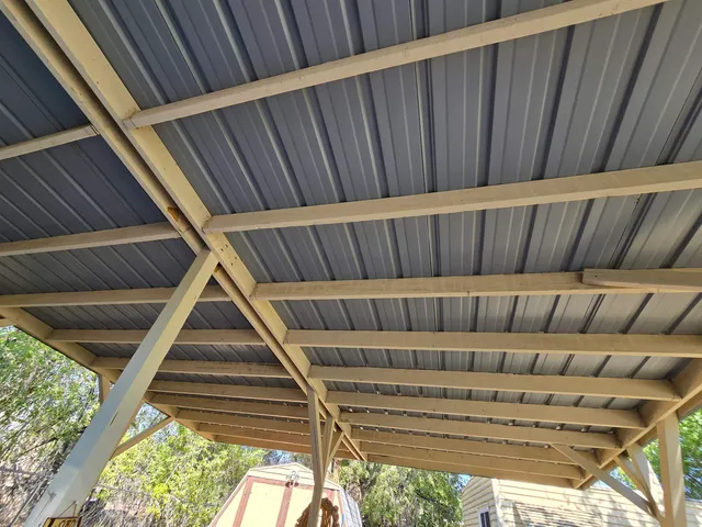 a view of porch with wooden stairs