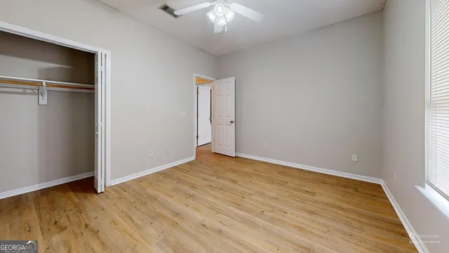 a kitchen with stainless steel appliances granite countertop a stove a sink dishwasher and a microwave oven with cabinets