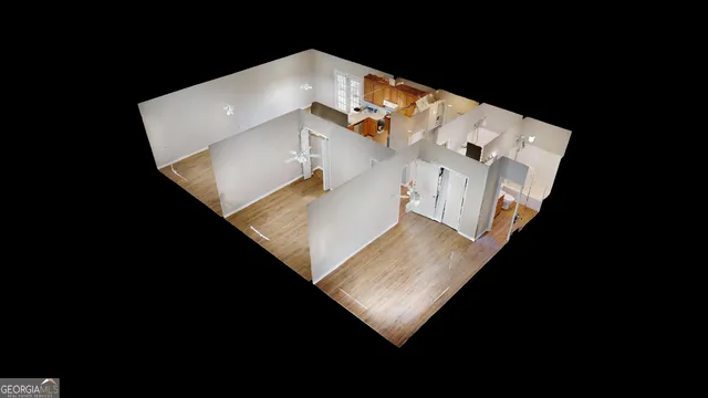 a view of a living room with furniture and stairs