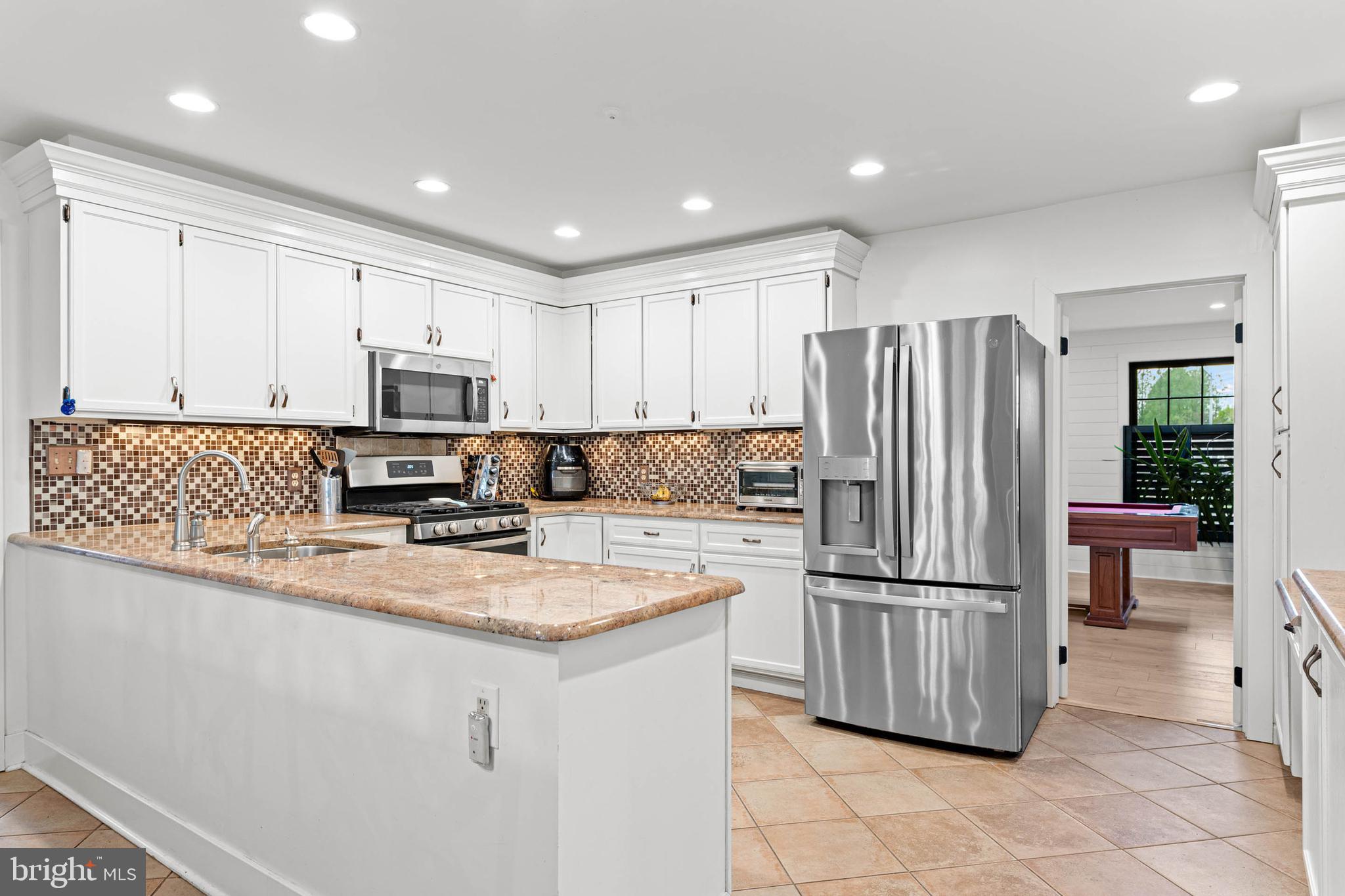 22 Russell Place Ambler, PA 19002 - Photo 23 of 65 a kitchen with stainless steel appliances granite countertop a refrigerator sink and microwave