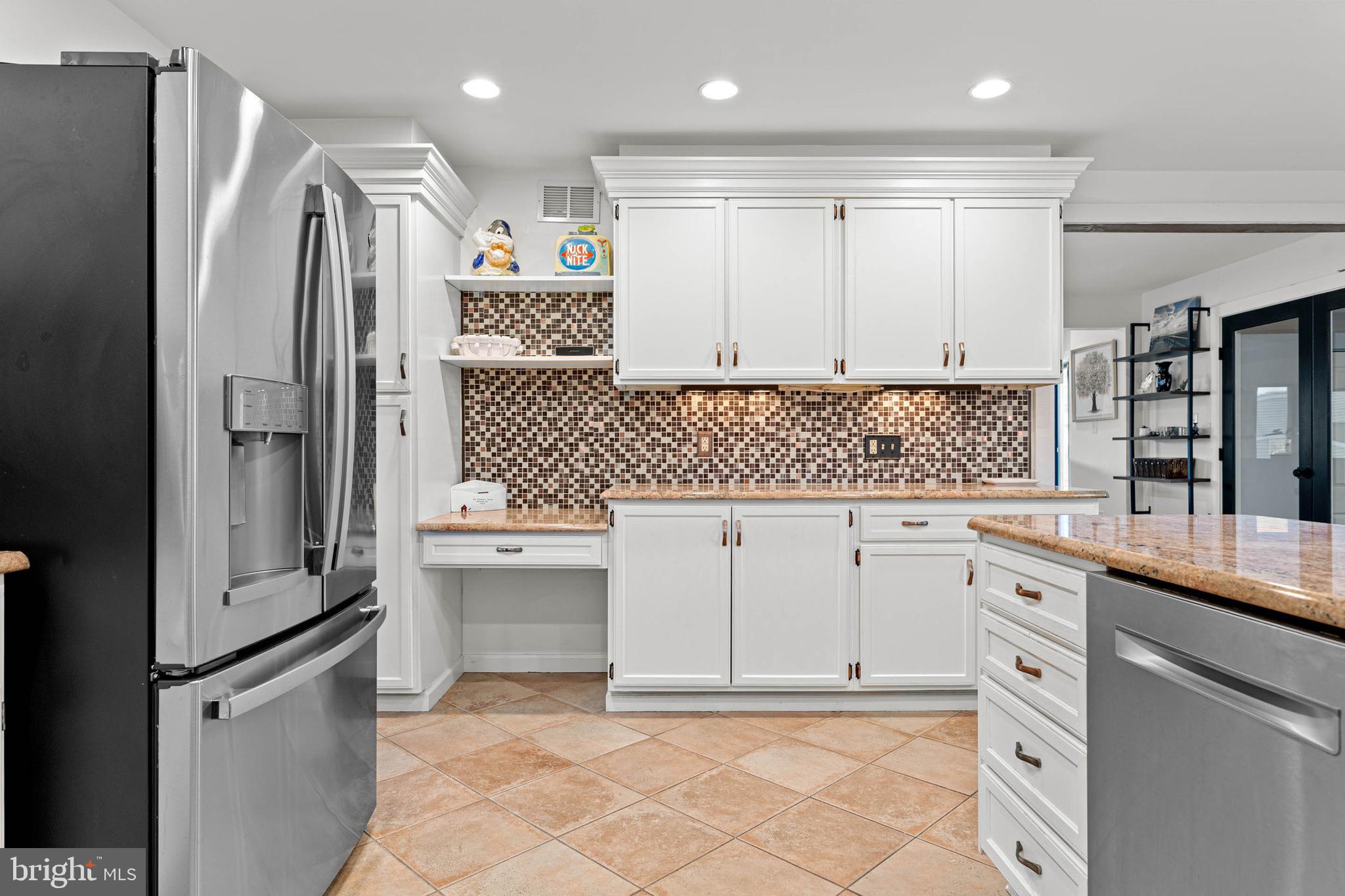 22 Russell Place Ambler, PA 19002 - Photo 26 of 65 a kitchen with white cabinets and white appliances