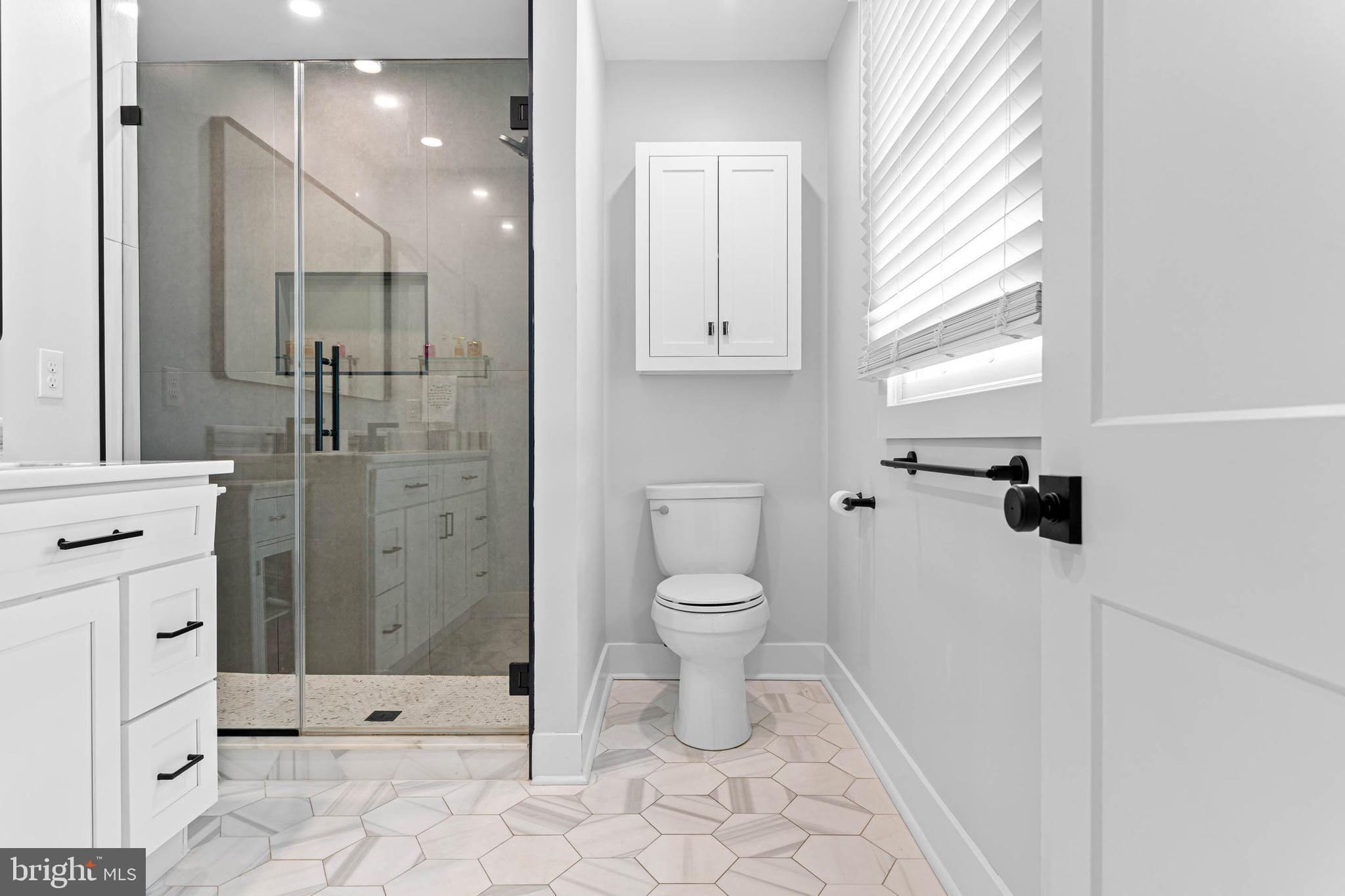 22 Russell Place Ambler, PA 19002 - Photo 37 of 65 a bathroom with a toilet sink and shower