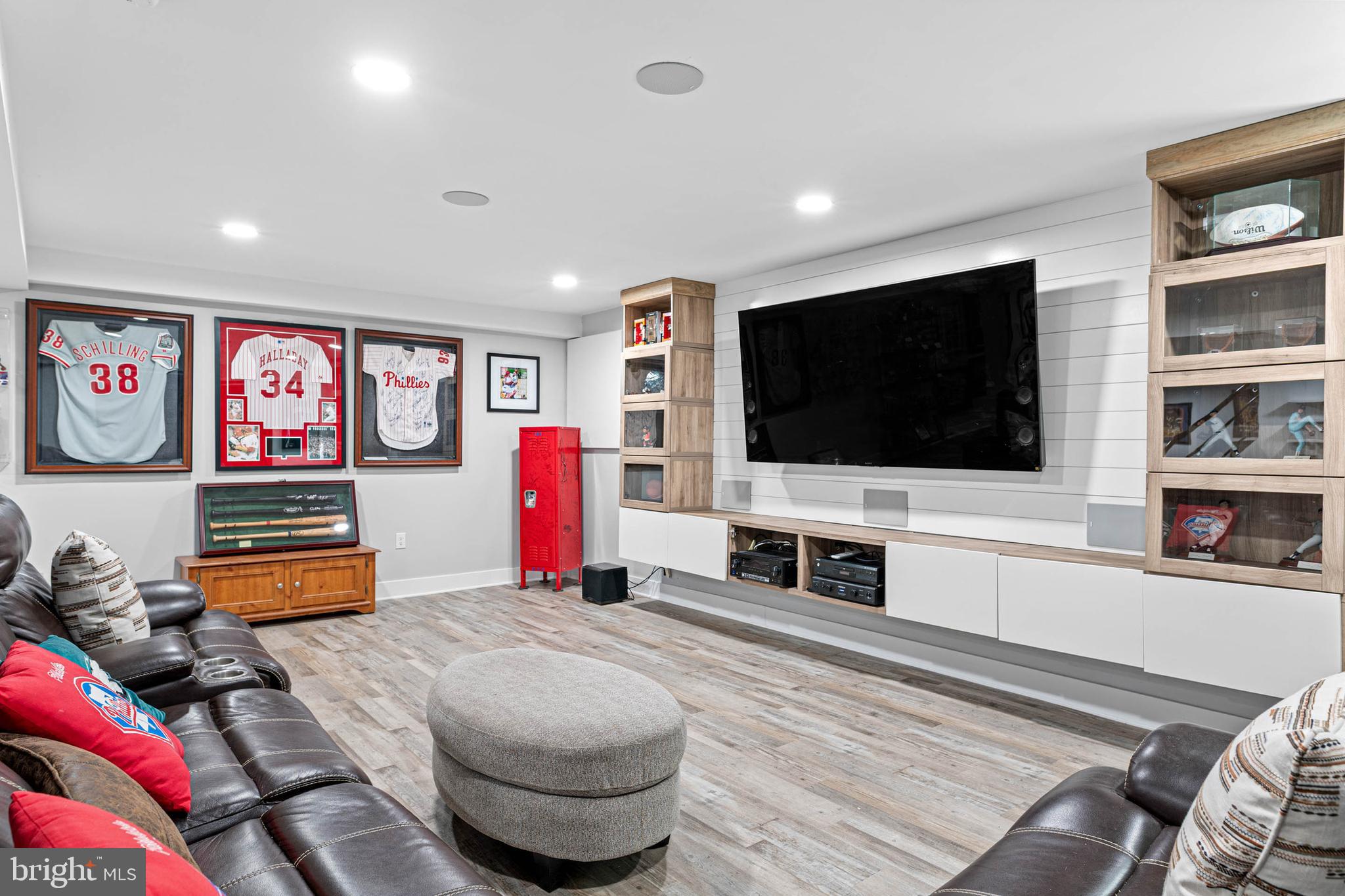 22 Russell Place Ambler, PA 19002 - Photo 49 of 65 a living room with flat screen tv and gym equipment