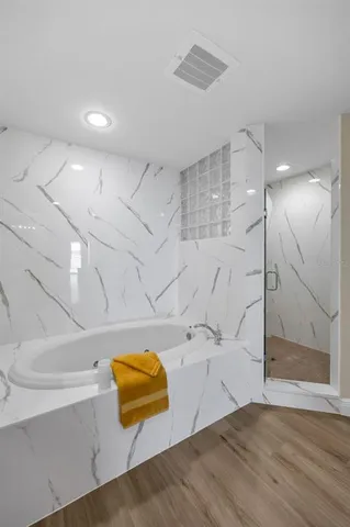 a dining room with furniture and a floor to ceiling window