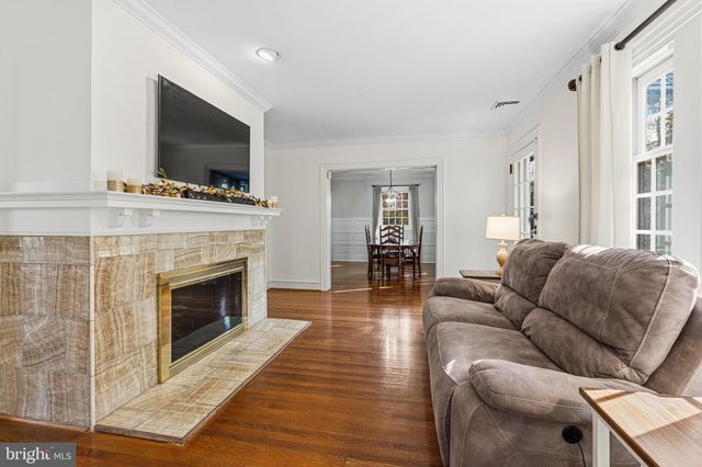 a view of entryway and gallery with wooden floor