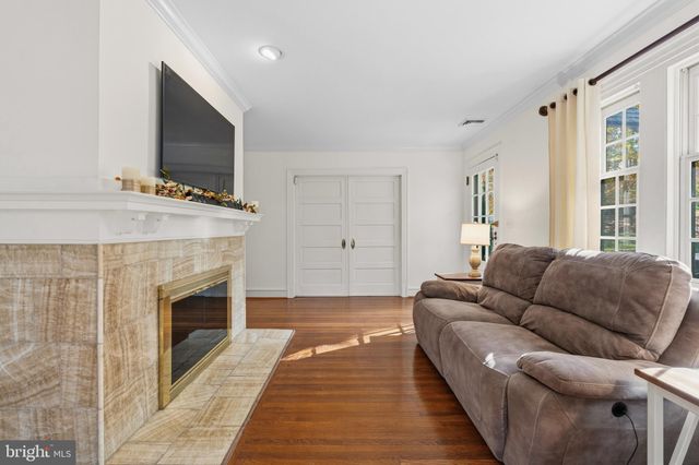 a kitchen with stainless steel appliances granite countertop a sink refrigerator and cabinets