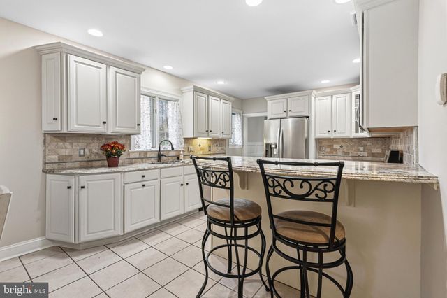 a spacious bedroom with a bed and window