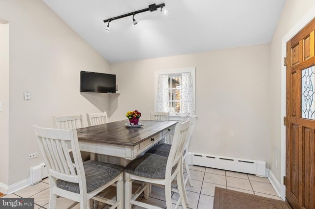 a bathroom with a double vanity sink mirror and shower