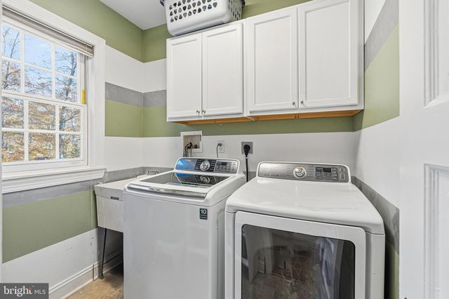 a living room with furniture and windows