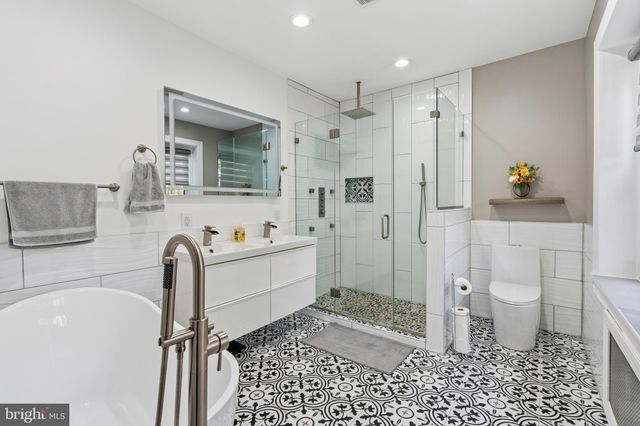 a living room with a bed furniture and a window