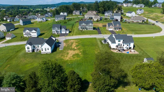 an aerial view of a house with a garden house swimming pool and outdoor seating