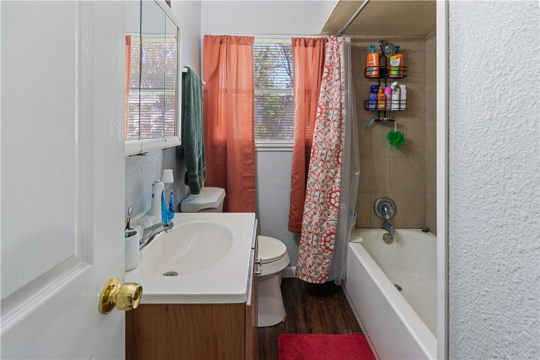 4846 Kasper Street Corpus Christi, TX 78415 - Photo 16 of 20 a bathroom with a sink and a bathtub