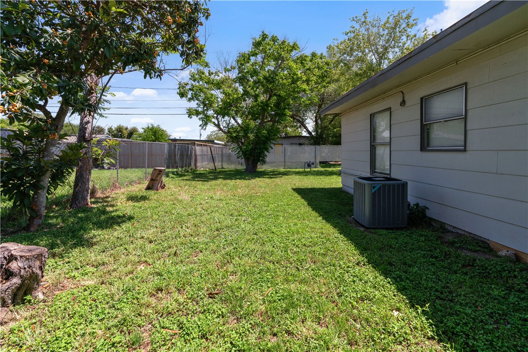 4846 Kasper Street Corpus Christi, TX 78415 - Photo 19 of 20 a view of a backyard with plants and a patio