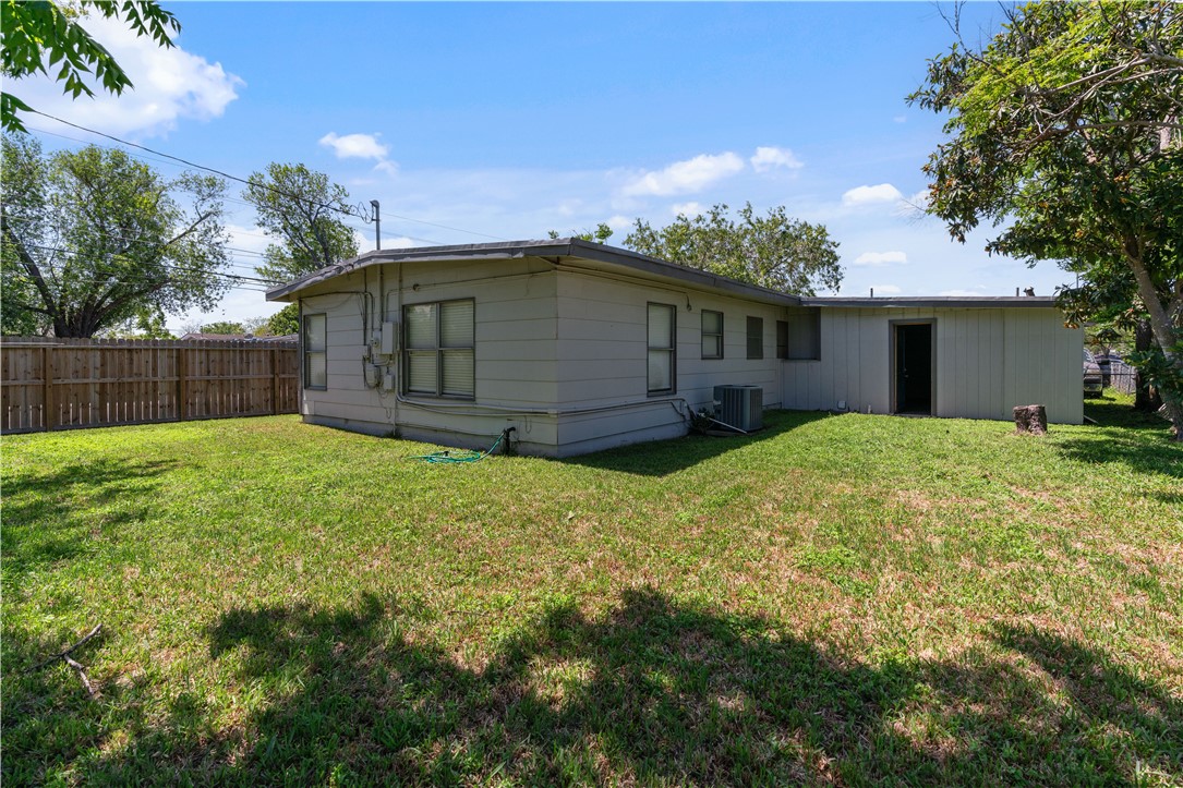 4846 Kasper Street Corpus Christi, TX 78415 - Photo 20 of 20 a view of a small house with a small yard and a large tree