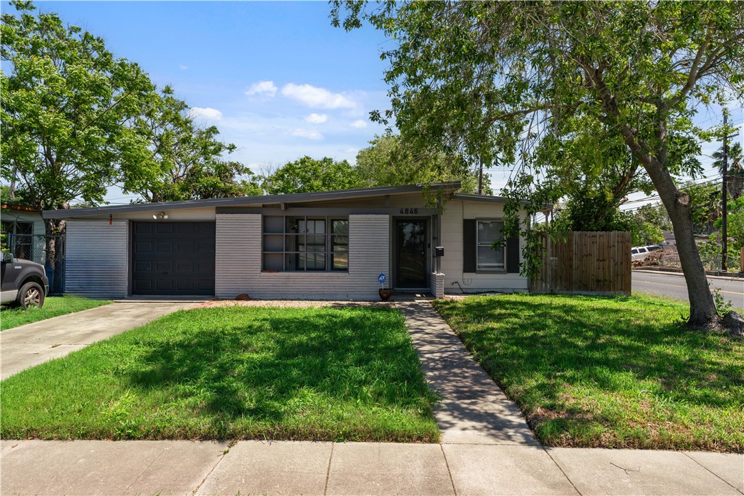 4846 Kasper Street Corpus Christi, TX 78415 - Photo 2 of 20 front view of a house with a yard