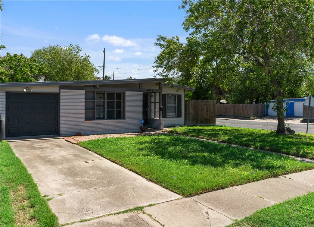 4846 Kasper Street Corpus Christi, TX 78415 - Photo 3 of 20 front view of a house with a yard