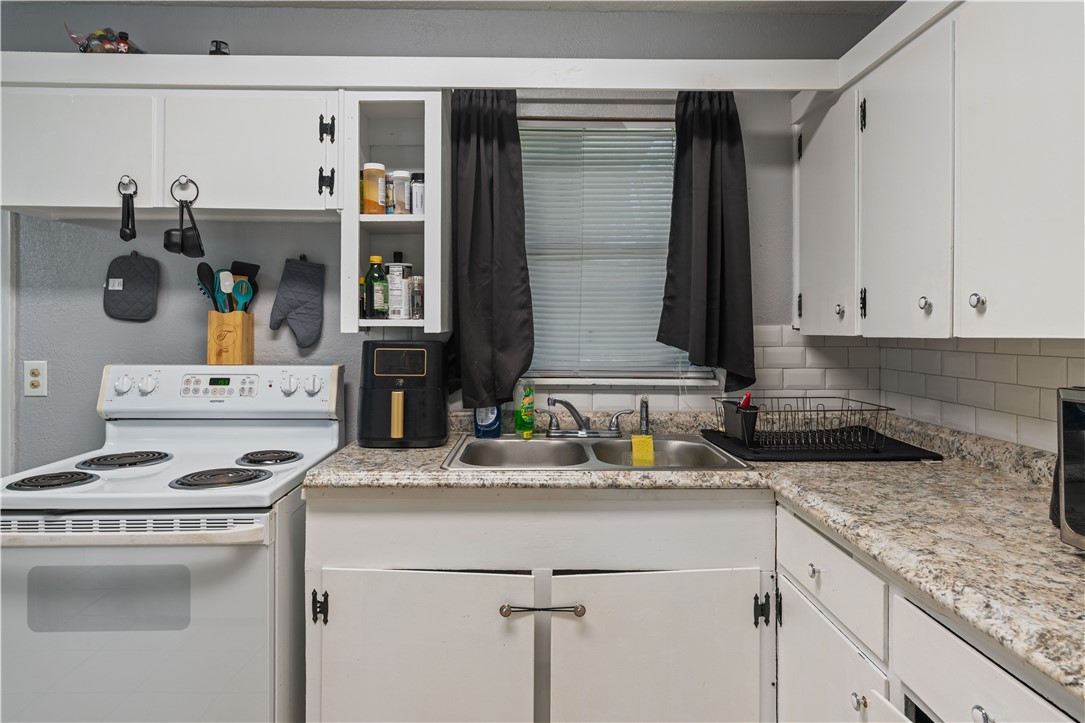 4846 Kasper Street Corpus Christi, TX 78415 - Photo 9 of 20 a kitchen with a sink and cabinets