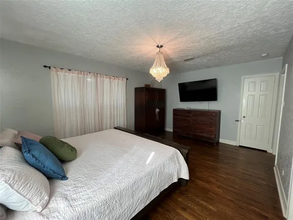 a bathroom with a shower and a bath tub