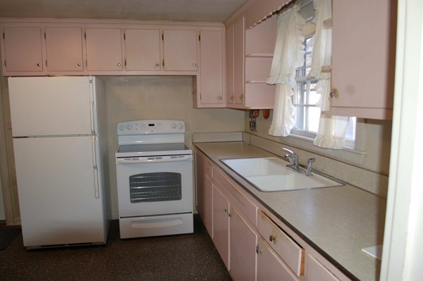 1 Cedarview Road Ipswich, MA 01938 - Photo 2 of 13 a kitchen with a sink stove and refrigerator