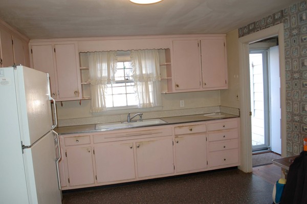 1 Cedarview Road Ipswich, MA 01938 - Photo 3 of 13 a kitchen with white cabinets and sink