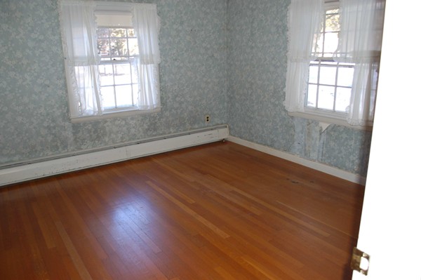 1 Cedarview Road Ipswich, MA 01938 - Photo 7 of 13 an empty room with wooden floor and windows