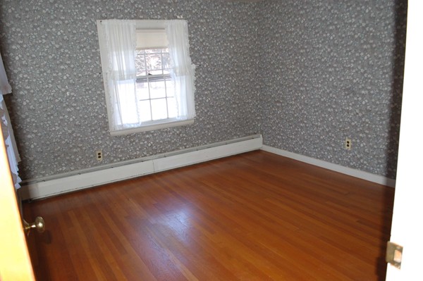 1 Cedarview Road Ipswich, MA 01938 - Photo 8 of 13 an empty room with wooden floor and windows