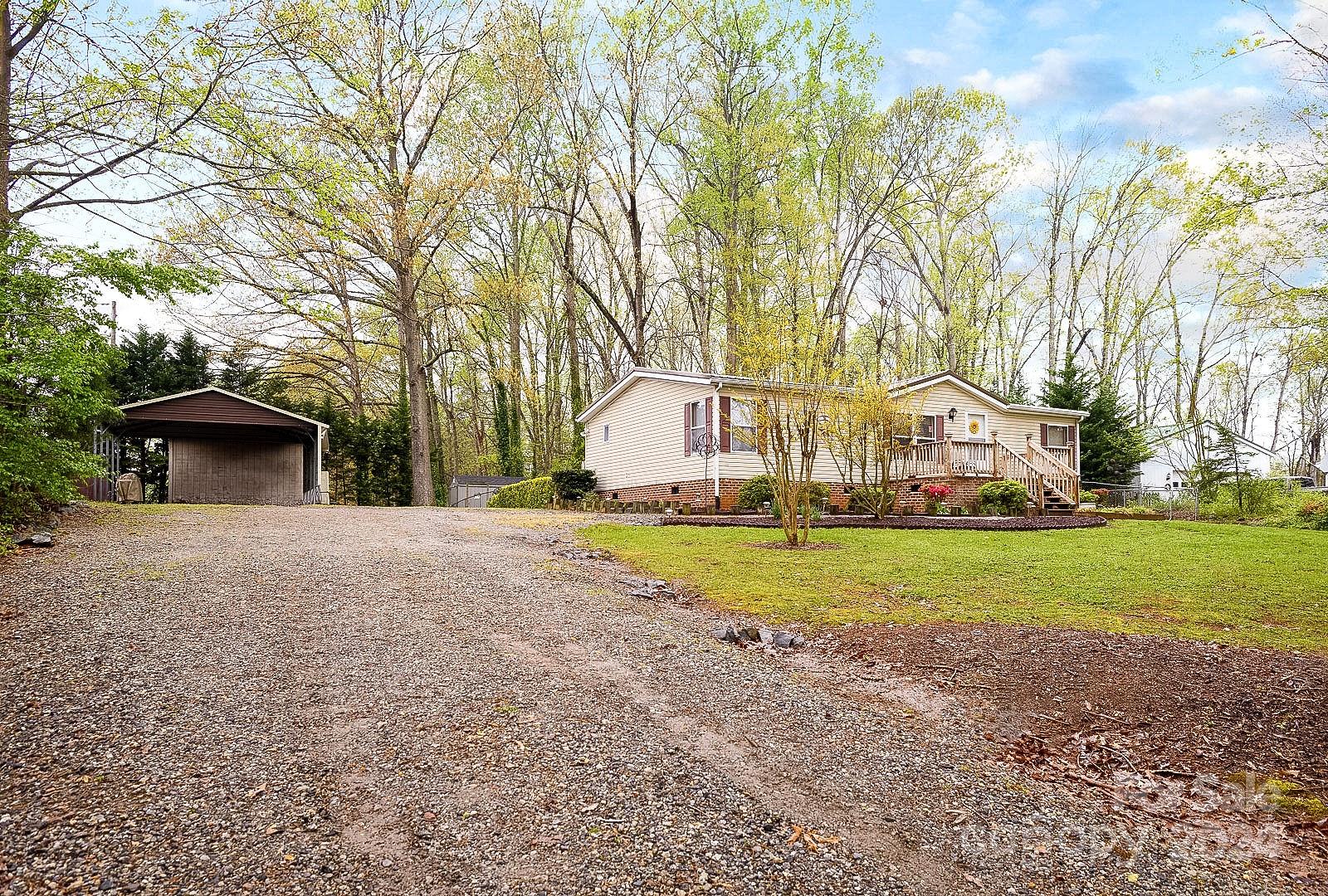 740 Childers Road Cleveland, NC 27013 - Photo 16 of 24 a front view of house with yard and trees