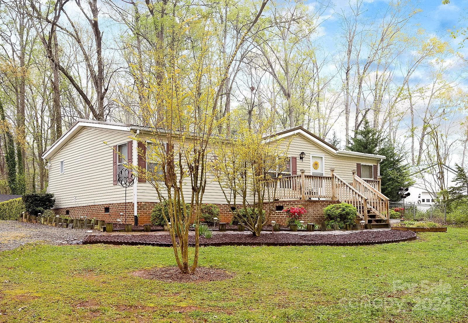 740 Childers Road Cleveland, NC 27013 - Photo 17 of 24 a front view of house with yard and swimming pool