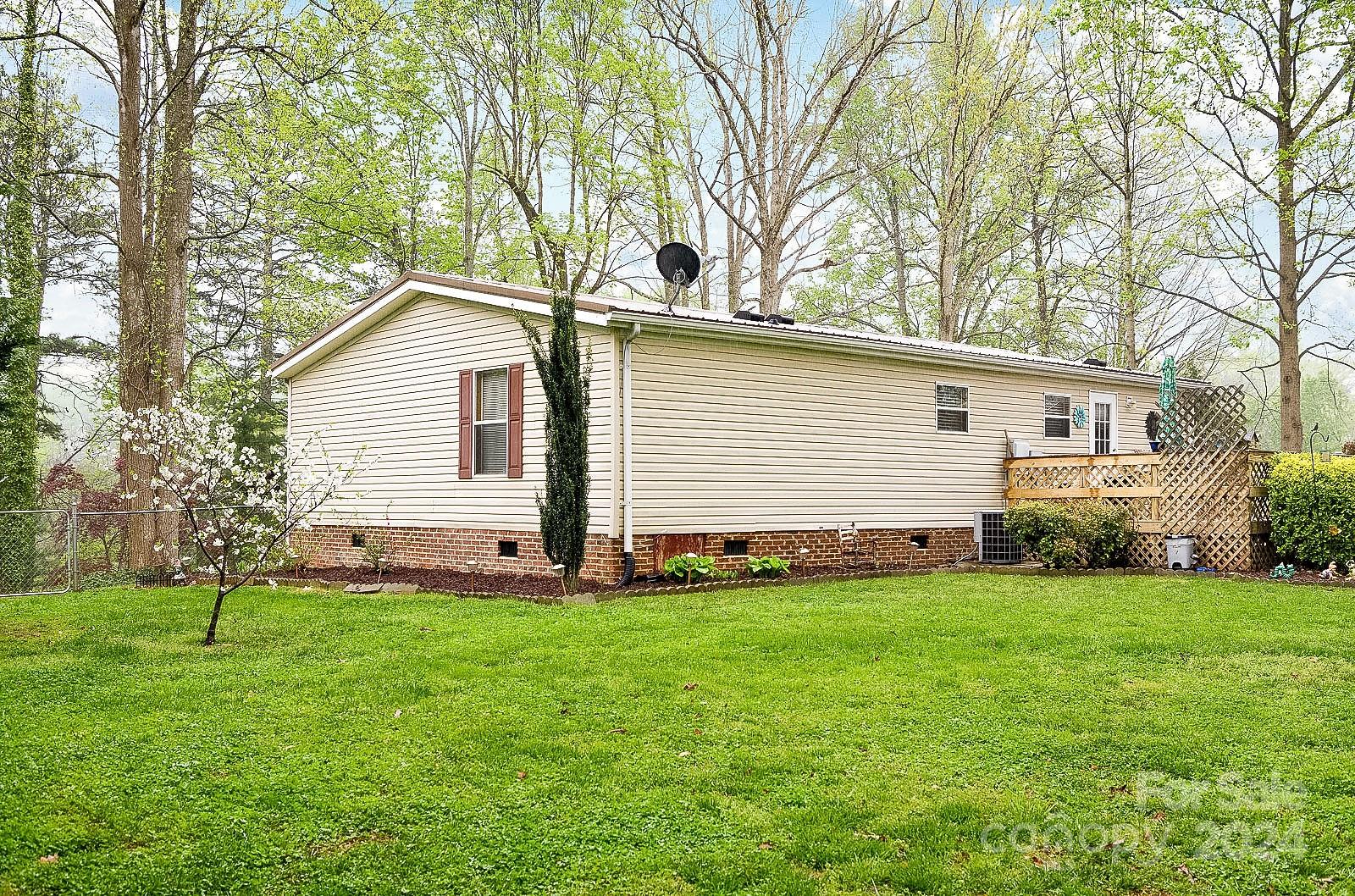 740 Childers Road Cleveland, NC 27013 - Photo 19 of 24 a front view of a house with a yard and trees