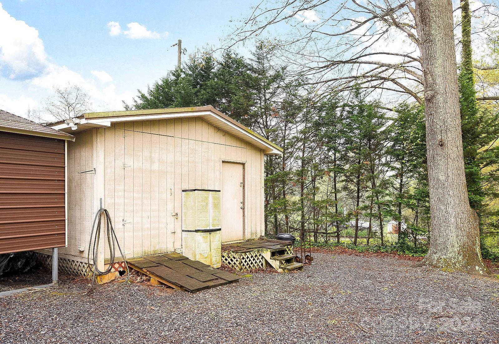 740 Childers Road Cleveland, NC 27013 - Photo 22 of 24 a backyard of a house with table and chairs