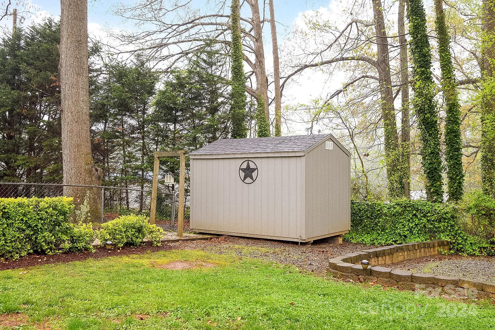 740 Childers Road Cleveland, NC 27013 - Photo 24 of 24 a view of backyard with tree and plants