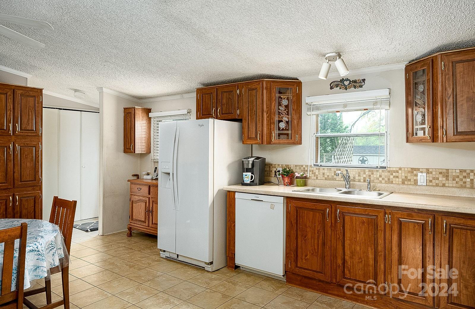 740 Childers Road Cleveland, NC 27013 - Photo 5 of 24 a kitchen with stainless steel appliances a refrigerator and a sink