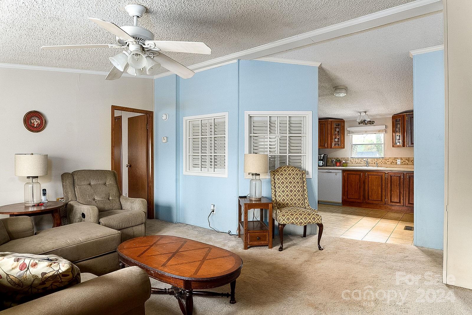 740 Childers Road Cleveland, NC 27013 - Photo 7 of 24 a living room with furniture and a chandelier