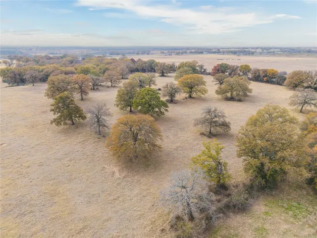 an aerial view of ocean with beach