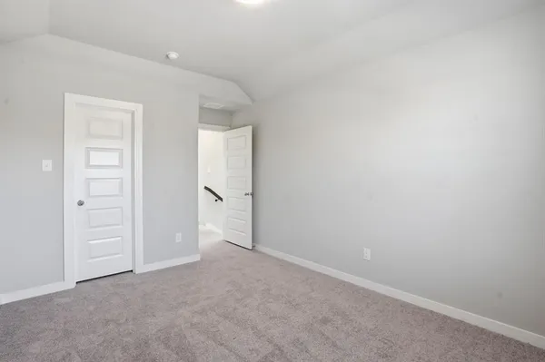 an empty room with closet area