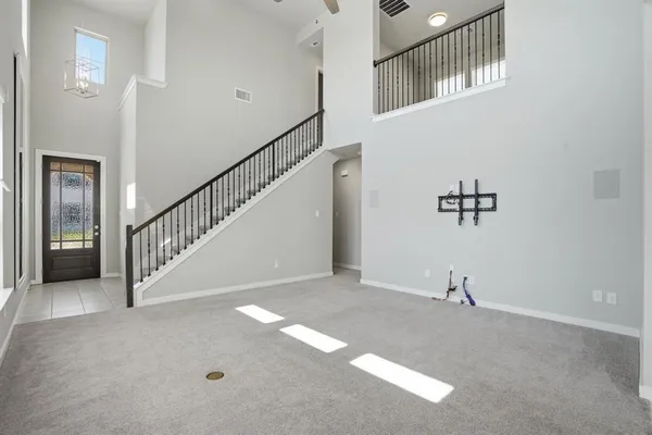 a view of a hallway with staircase