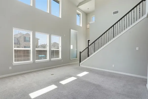 a view of an empty room with stairs