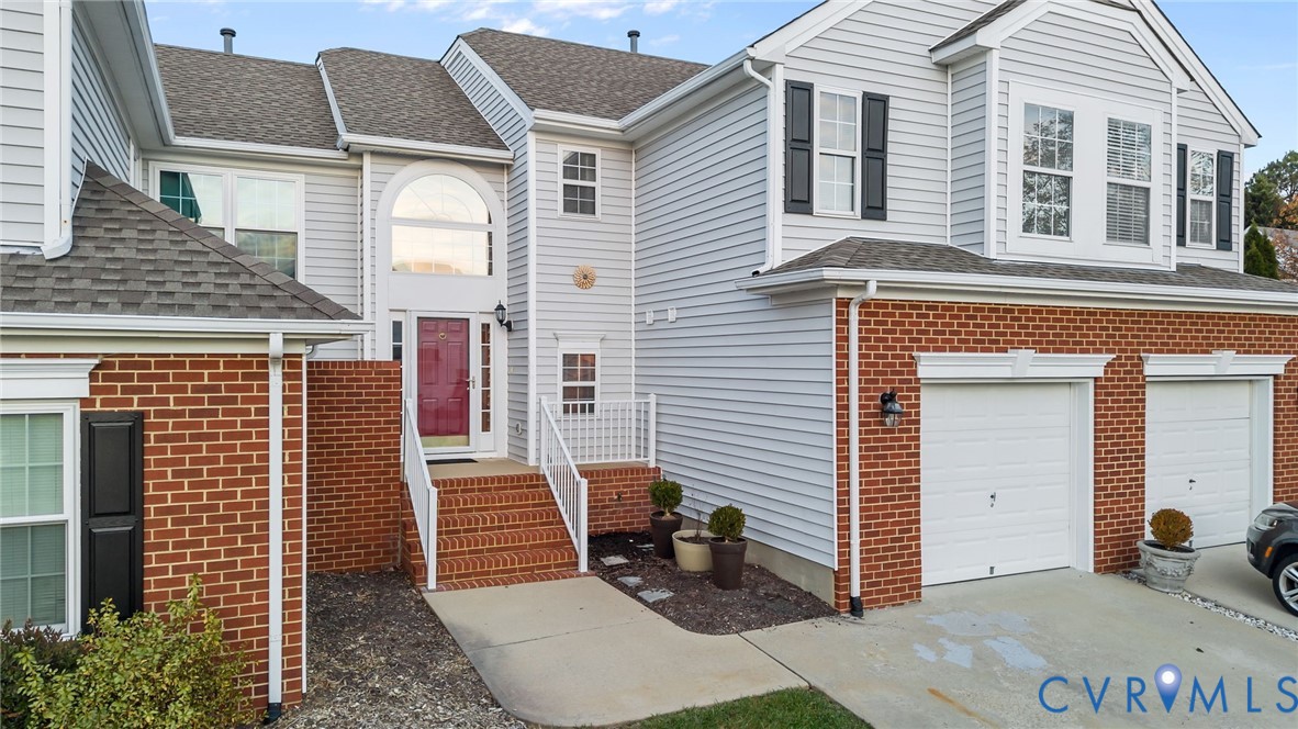 6106 Lookout Point Circle Midlothian, VA 23112 - Photo 1 of 42 a view of a house with a door and wooden bench