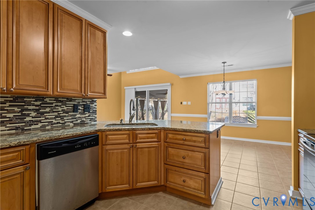 6106 Lookout Point Circle Midlothian, VA 23112 - Photo 11 of 42 a kitchen with granite countertop a sink and cabinets