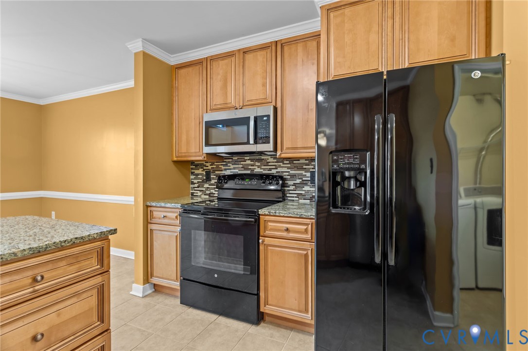 6106 Lookout Point Circle Midlothian, VA 23112 - Photo 12 of 42 a kitchen with stainless steel appliances granite countertop a refrigerator stove and oven