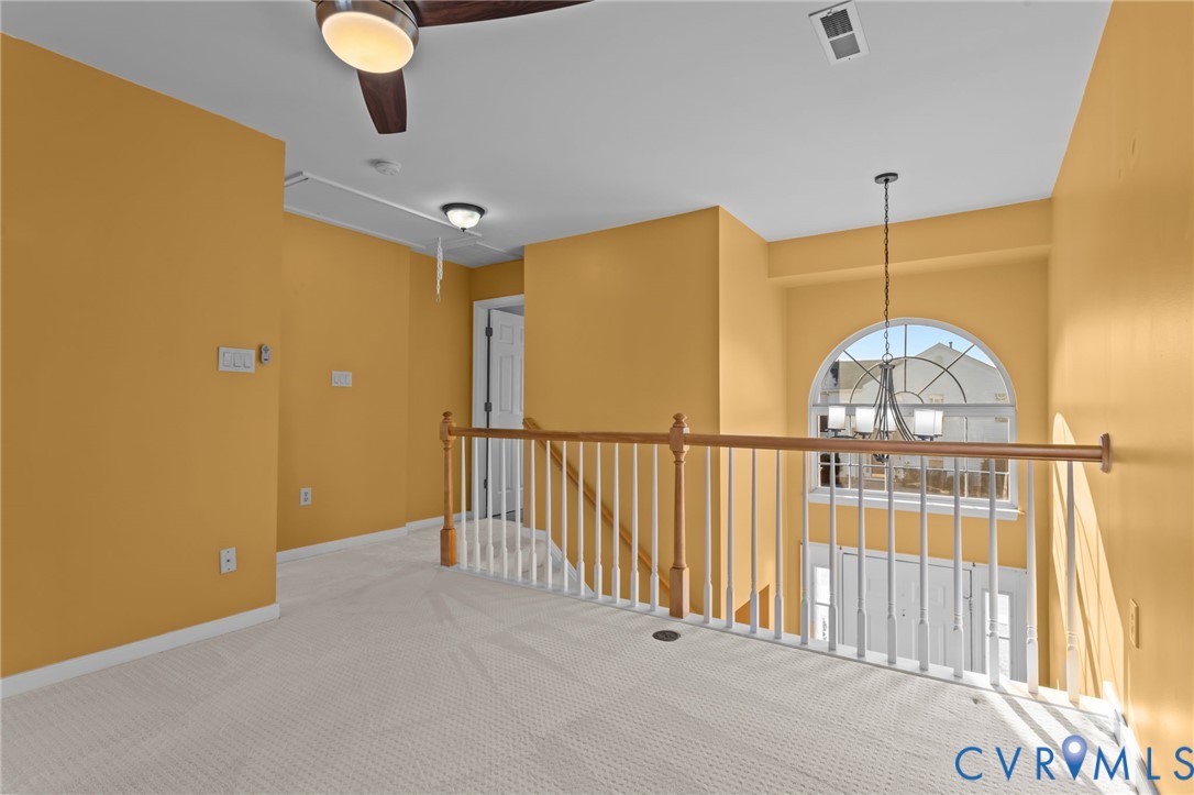 6106 Lookout Point Circle Midlothian, VA 23112 - Photo 18 of 42 a view of a hallway with a chandelier