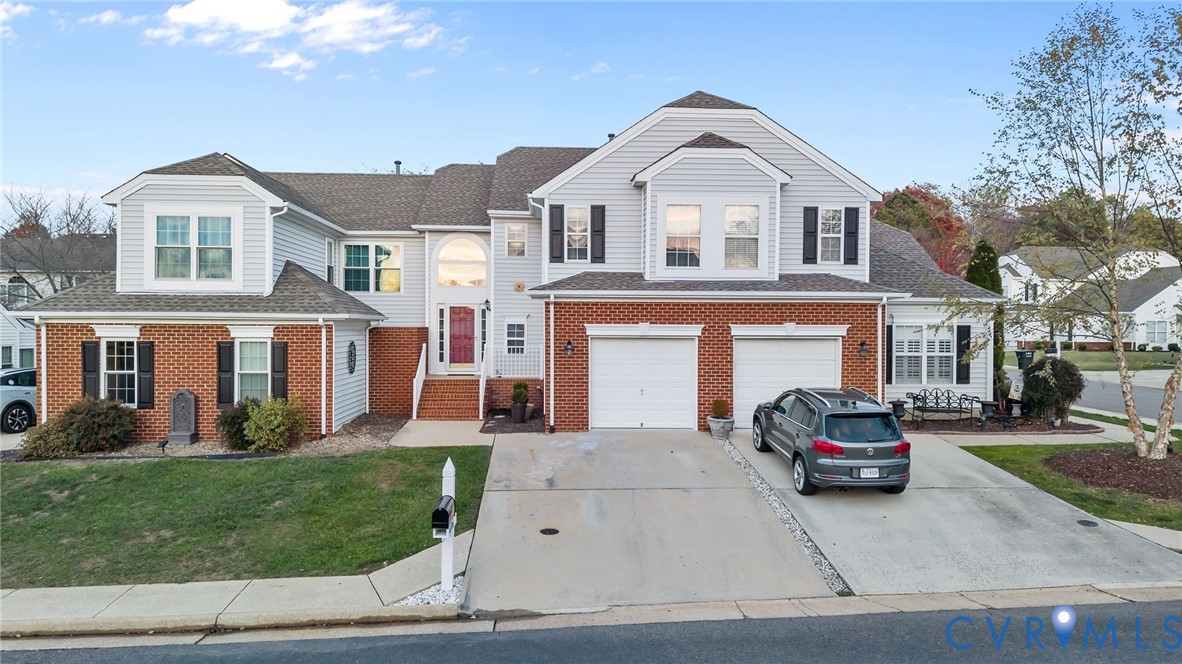 6106 Lookout Point Circle Midlothian, VA 23112 - Photo 2 of 42 a front view of a house with a garden and parking